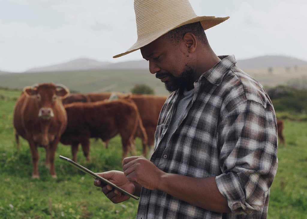 Farmer with digital tablet - Zoetis Foundation